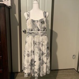 White and black Dress with straps .